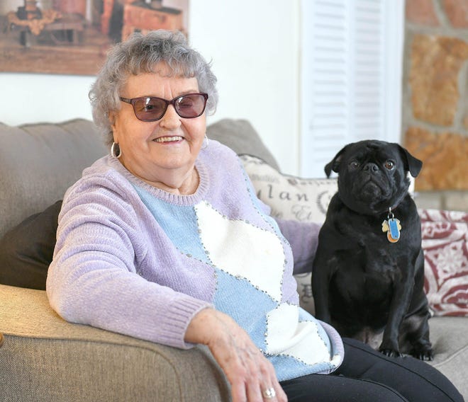 Myrl Legg, sitting with her dog, Marley, in her Canton Township home. She was a leap year baby, born Feb. 29, 1932, and traditionally celebrates her birthday along with her daughter, who was born March 5. (CantonRep.com / Ray Stewart)