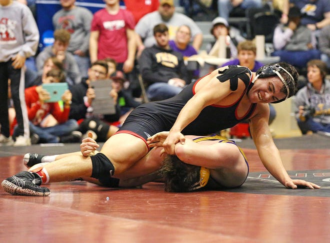 Rossville's Kody Davoren wrestles against Trego's Dillon Dunn in the 220-pound match in the semifinals of the 3-2-1A state championship Friday at Gross Memorial Coliseum in Hays. [JOLIE GREEN/HAYS DAILY NEWS]