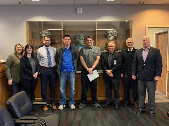 Commissioners proclaimed March as Developmental Disabilities Awareness Month in Tuscarawas County on Wednesday. Pictured are Chris Sapp (left), Kerri Silverthorn, Nate Kamban, Nathan Davis, Richard Anderson, Commissioner Chris Abbuhl, Commissioner Joe Sciarretti and Commissioner Al Landis.  (Submitted photo)