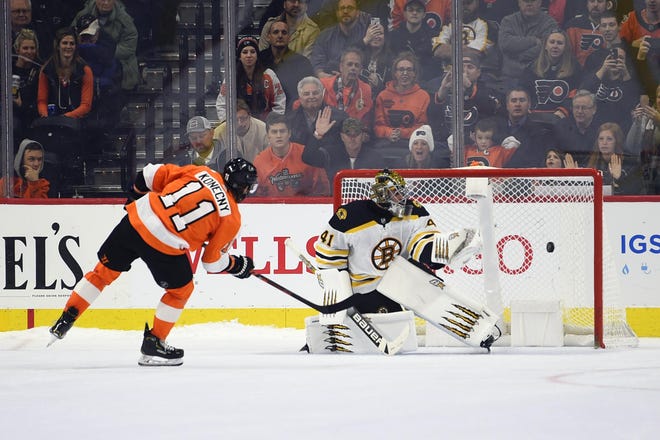 The Flyers' Travis Konecny scores on Bruins goaltender Jaroslav Halak during a shootout. [DERIK HAMILTON / ASSOCIATED PRESS]