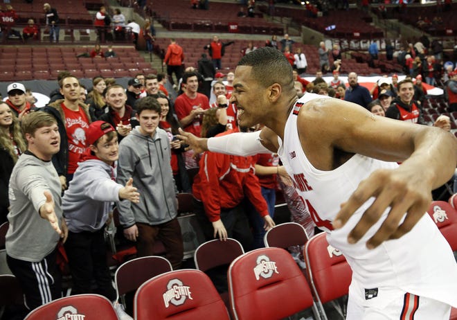 Ohio State Buckeyes forward Kaleb Wesson (34) high fives students following the NCAA men's basketball game against the Indiana Hoosiers at Value City Arena in Columbus on Saturday, Feb. 1, 2020. Ohio State won 68-59. [Adam Cairns/Dispatch]