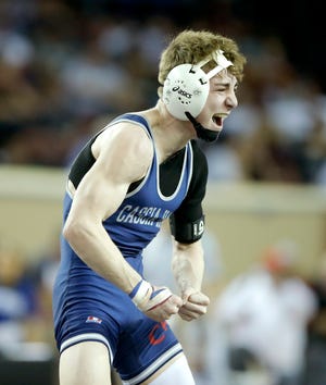 Tulsa Cascia Hall's Eli Griffin celebrates after winning the Class 4A 113-pound championship match during the state tournament at State Fair Arena in Oklahoma City on Feb. 29, 2020. [Bryan Terry/The Oklahoman]