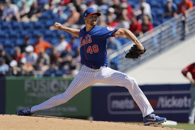 New York Mets pitcher Jacob deGrom, a former Savannah Sand Gnats standout in the Class A South Atlantic League, throws during the first inning of a spring training game against the Washington Nationals on Sunday in Port St. Lucie, Fla. [JEFF ROBERSON/THE ASSOCIATED PRESS]