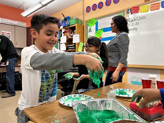 Baca Elementary School first grader Isaac Bogarin has fun fashioning baking soda "eggs" as part of Monday's celebration of Dr. Seuss' birthday. [CHIEFTAIN PHOTO/ANTHONY A. MESTAS]