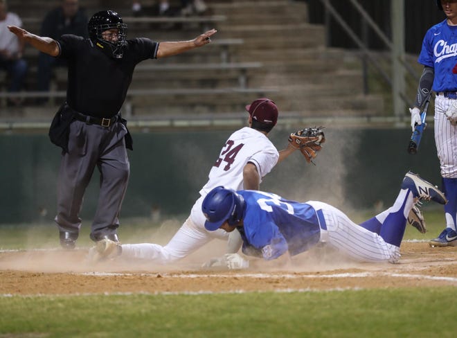 Westlake’s Bailey Covert slides safely at home under the tag of Austin High’s Victor Mendoza during a 6-2 Westlake Tuesday at Burger Field . [PAUL BRICK/FOR STATESMAN]