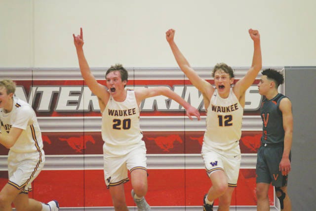 Wuakee juniors Payton Sandfort and Tucker DeVries celebrating after capturing the 59-55 win in the substate final over Valley Tuesday, Mar. 3. PHOTO BY ANDREW BROWN/DALLAS COUNTY NEWS