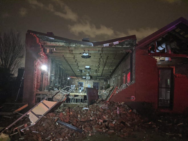 Bricks from a collapsed wall of the Geist restaurant litter the ground after a tornado touched down in downtown Nashville, Tuesday, March 3, 2020. (Alex Carlson via AP)