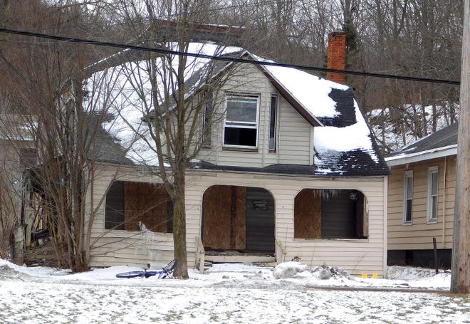 Ilion village crews have boarded up the house at 240 E. Main St., following complaints about rodents and reports that youths were getting inside. [DONNA THOMPSON/TIMES TELEGRAM]