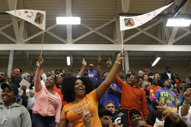 Cedar Shoals fans cheer during the team’s quarterfinal game against Lithonia last Wednesday. The Jaguars play Dutchtown for the state championship Friday night at 8. [Photo/Joshua L. Jones, Athens Banner-Herald]