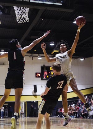 Hesperia’s Jonathan McCullough drives the lane for a layup in the opening round of the CIF Southern Regional Basketball Championships on Tuesday. [JOSE HUERTA FOR THE DAILY PRESS]