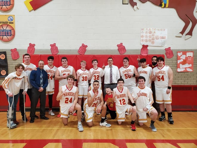 Reading's boys basketball team poses in the school's Kerspilo Gymnasium Tuesday night, after defeating Homer 63-59 to win a share of the Big 8 title. Courtesy/Brett Kerspilo