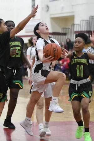 Leah Sylvain, Westport High School freshman, drives to the basket during Wednesday's South semifinal loss to defending state champion Cathedral on Wednesday at Bridgewater-Raynham High School. She scored a game-high 24 points. [Photo | Rob Tierney]