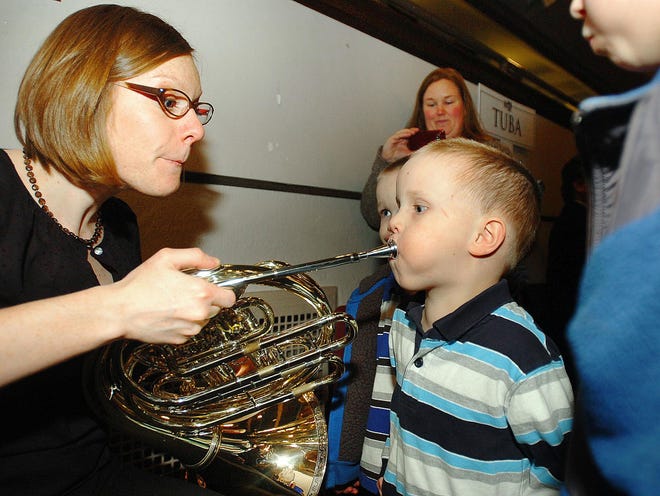 Kids get hands-on experience with instruments at Plymouth Philharmonic’s annual family concert. Ledger file photo