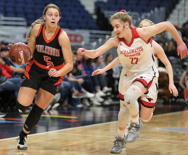 Schulenburg’s Brynlee Hollas tries to shake off Shallowater’s Tiffany Davis during a Class 3A girls basketball state semifinal game Thursday at the Alamodome in San Antonio. The Fillies advanced to Saturday’s championship with a 61-26 win. [Charles Bryce/San Angelo Standard-Times]
