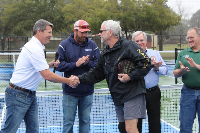 Members of the city council, city staff and local pickleball enthusiasts came together for a ribbon cutting at the renovated park. [CONTRIBUTED PHOTO]