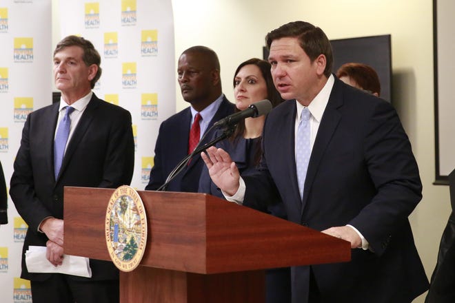Florida Gov. Ron DeSantis speaks about the COVID-19 virus during a news conference at the Florida Department of Health on Monday in Miami. [Brynn Anderson/The Associated]
