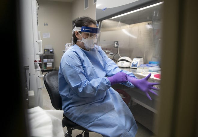 Microbiologist Chelsey Tiger tests samples for viruses in the virology lab at the Department of State Health Services Laboratory Building on Thursday March 5, 2020, where coronavirus tests will begin tomorrow. [JAY JANNER/AMERICAN-STATESMAN]