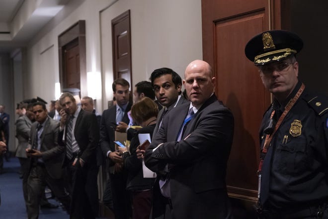 Police, press, and congressional staff wait outside a closed-door meeting between members of the House of Representatives and Vice President Mike Pence and the White House coronavirus task force, on Capitol Hill in Washington, Wednesday, March 4, 2020. (AP Photo/J. Scott Applewhite)