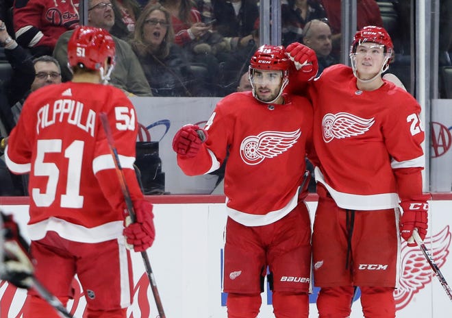 Detroit Red Wings center Robby Fabbri, center, celebrates his second-period goal against the Chicago Blackhawks with center Valtteri Filppula (51) and defenseman Gustav Lindstrom, right, during an NHL hockey game Friday, March 6, 2020, in Detroit. (AP Photo/Duane Burleson)