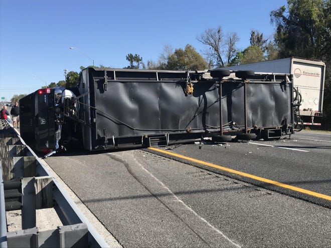 A Dodge 4X4 and trailer driven by an Ohio woman and traveling north on I-75 overturned Saturday morning. [Photo by Austin L. Miller/Ocala Star Banner]