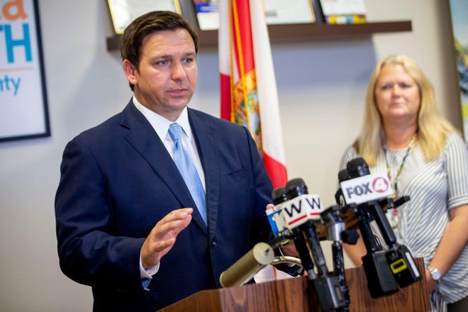 Gov. Ron DeSantis speaks about Florida's response to the spread of coronavirus during a press conference at the Florida Department of Health on Friday in Naples. [ALEX DRIEHAUS/NAPLES DAILY NEWS]