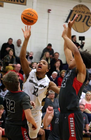 Ja’Hari Mitchell takes a shot against Patton in their playoff meeting in February. [Brittany Randolph / The Star]