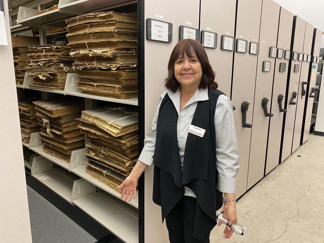 Charlene Garcia Simms, special collections librarian at the Robert Hoag Rawlings Public Library, helps maintain thousands of archives housed in the library's vault. The vault will get several upgrades thanks to a $500,000 grant. [CHIEFTAIN PHOTO/ANTHONY A. MESTAS]