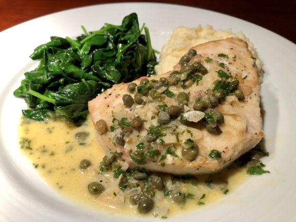Swordfish with creamy caper sauce is worth making at home. [LAURIE HIGGINS PHOTO]