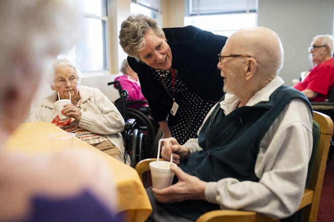 Christopher House Administrator Sandra Mahoney checks in on residents Dorothy Kelly and Rev. Norman Meiklejohn during an ice cream social Wednesday. [T&G Staff/Ashley Green]