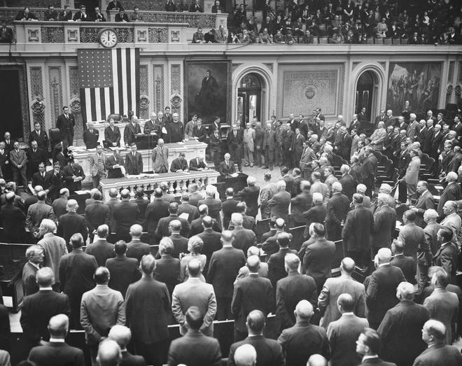 The special session of Congress that President Franklin Roosevelt called to deal with the banking crisis gets underway March 9, 1933. The House of Representatives is called to order and the membership is shown bowed in prayer before beginning. [THE ASSOCIATED PRESS]