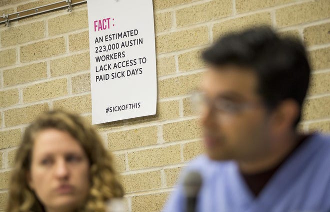 A sign claims 223,000 Austin workers are employed without paid sick days during a 2018 public forum about an ordinance requiring sick pay in Austin. The Austin City Council passed an ordinance that year that mandated sick pay for all private employers in the city limits. But the law has been on hold because of court challenges. [NICK WAGNER/AMERICAN-STATESMAN file]
