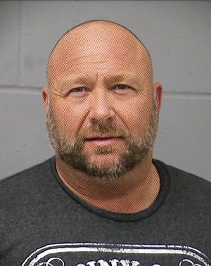 In this Tuesday, March 10, 2020 booking photo provided by the Travis County (Texas) Sheriff's Office is Alex Jones. Jones was arrested in Texas on a misdemeanor charge of driving while intoxicated, authorities said Tuesday, March 10, 2020. Jones was booked into an Austin jail shortly after midnight and released on bond a few hours later, sheriff's office spokeswoman Kristen Dark said. (Travis County Sheriff's Office via AP)
