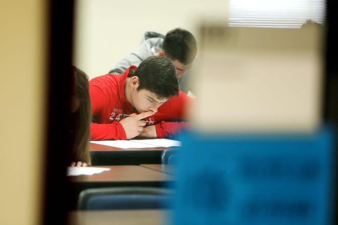 A Southeastern Community College takes a mid-term exam Wednesday in a classroom on the West Burlington campus. The school is working on a plan for coronavirus but is still open. The campus has spring break next. [John Lovretta/thehawkeye.com]