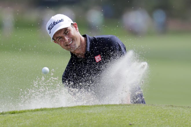 Adam Scott, of Australia, hits from a bunker on the ninth hole during a practice round for The Players Championship Wednesday in Ponte Vedra Beach, Fla. [Lynne Sladky/Associated Press]