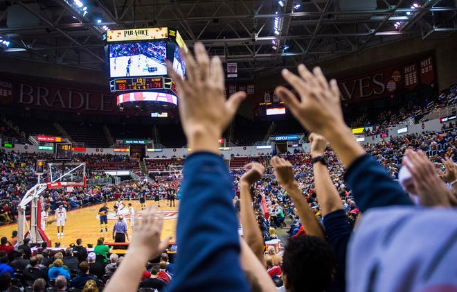 March Madness continues as Althoff fans cheer during their Class 3A matchup at Carver Arena in Peoria in 2015. [FRED ZWICKY/JOURNAL STAR FILE]