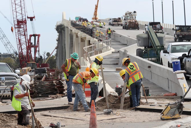The new Orange Avenue bridge, originally planned to be open a year ago, has bogged down with more delays. The hope now is the bridge will reopen to traffic next month and be totally done by May 30. [News-Journal/David Tucker]