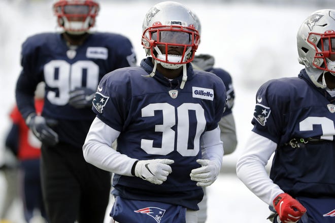 Patriots cornerback Jason McCourty recently had his option picked up on his contract keeping him in New England for a third season. [AP File Photo/Steven Senne]
