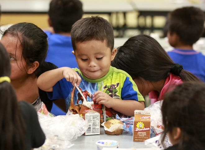 Three-year-old Jesus Miguel Francisco enjoys a free lunch with family members at Highland Elementary in Lake Worth Friday, September 15, 2017. Florida announced Saturday that it has asked the federal government for permission to continue serving free and reduced-cost breakfasts and lunches to 2 million low-income children while schools are closed because of the new coronavirus. [Bruce R. Bennett / The Palm Beach Post]