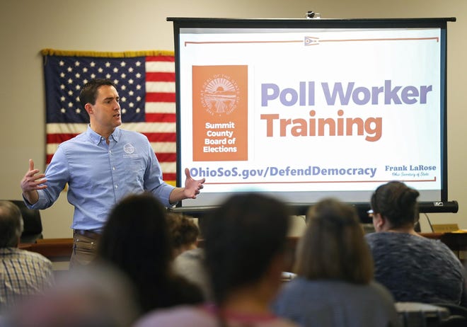 Ohio Secretary of State Frank LaRose speaks Sunday to several people training to be poll workers at the Summit County Board of Elections. Extra precautions will taken Tuesday amid coronavirus concerns. [Jeff Lange/Beacon Journal]