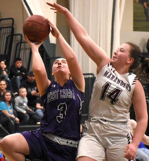 West Canada Valley Indian Olivia Carney (left) attempts a shot with Sherburne-Earlville Marauder Maria Albertina defending during the Center State Conference Exceptional Senior Game Tuesday at Herkimer College. [Jon Rathbun / Times Telegram]