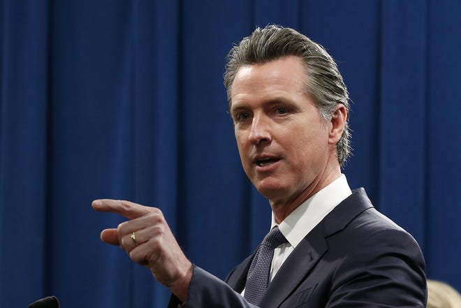 California Gov. Gavin Newsom established new guidelines for fighting the coronavirus by calling for the closure of bars, wineries and brewpubs, and emphasizing the need for social distancing. [RICH PEDRONCELLI/THE ASSOCIATED PRESS]