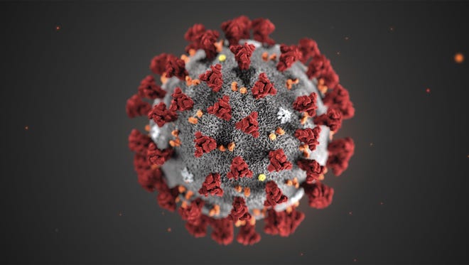 This illustration provided by the Centers for Disease Control and Prevention in January 2020 shows the 2019 Novel Coronavirus (2019-nCoV). This virus was identified as the cause of an outbreak of respiratory illness first detected in Wuhan, China. [CDC VIA AP]