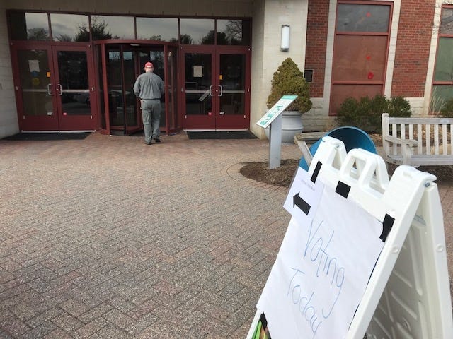 Wellesley's local election is expected to go ahead on Tuesday, but last-minute action by the state could still change that. The main library is one of the polling places. [Wicked Local File Photo/Cathy Brauner]