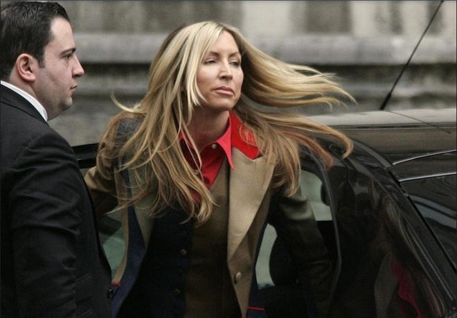 Heather Mills, right, arrives in central London’s Royal Courts of Justice, for the announcement of the judgment in her divorce case with Paul McCartney, Monday, March 17, 2008. McCartney, 65, and Mills, 40, went to court last month to decide on Mills’ share of the former Beatle’s fortune, which is estimated at as much as 825 million pounds (US$1.6 billion). Media reports have suggested McCartney offered his wife around 25 million pounds (US$50 million) and that she was seeking at least double that amount. (AP Photo/Lefteris Pitarakis)