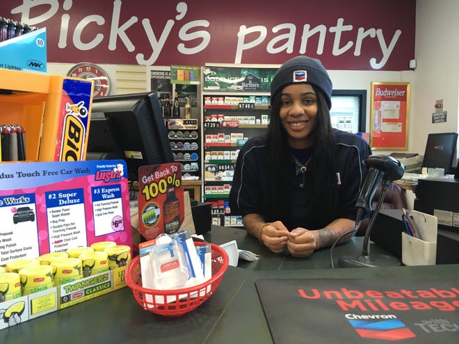 Adrian Stevenson runs the cashier at Picky’s Pantry gas station and convenience store in Westlake. Her manager, Ed Olmstead, was able to secure a small supply of hand sanitizer displayed on the counter. [EILEEN FLYNN/WESTLAKE PICAYUNE]