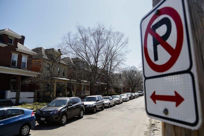 A parking rule that Columbus residents must move vehicles on city streets at least 75 feet within 72 hours is being suspended during the current coronavirus outbreak, the city announced Wednesday, March 18, 2020. [Dispatch file photo]