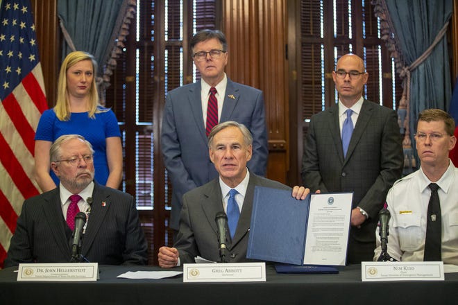Texas Gov. Greg Abbott and other top officials announced new state policies to combat the coronavirus in Austin on Thursday. [RICARDO B. BRAZZIELL/AMERICAN-STATESMAN]