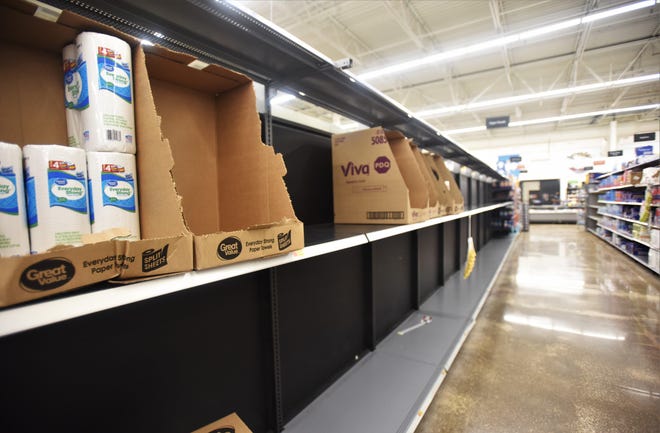 Shelves holding paper towels at Walmart in Bastrop were mostly bare on Sunday morning as shoppers purchased supplies amid the novel coronavirus pandemic. [TERRY HAGERTY/ FOR BASTROP ADVERTISER]