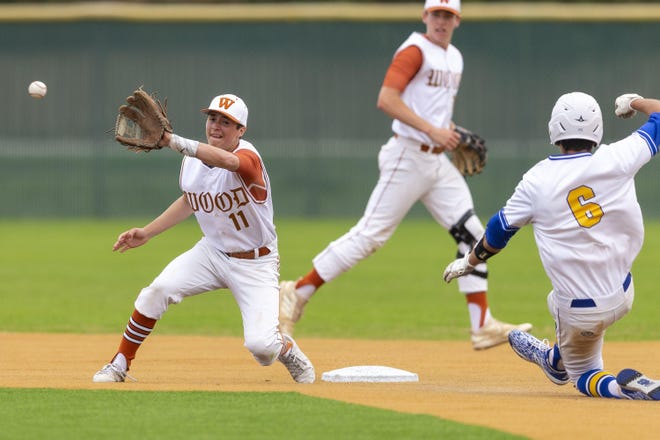 Westwood second baseman Gael Garcia, making the catch for the out against Lago Vista, and his teammates must now wait until at least May 4 to continue their season. [Stephen Spillman for Statesman]