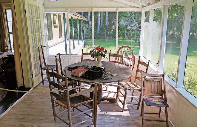 The front porch is where Rawlings did most of her writing. Seated in the deer-hide chairs at the cypress table, she could write and enjoy the Florida breezes and watch what was happening on

her farm and on the road. [COURTESY OF MARJORIE KINNAN RAWLINGS HISTORIC STATE PARK]